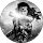 M B